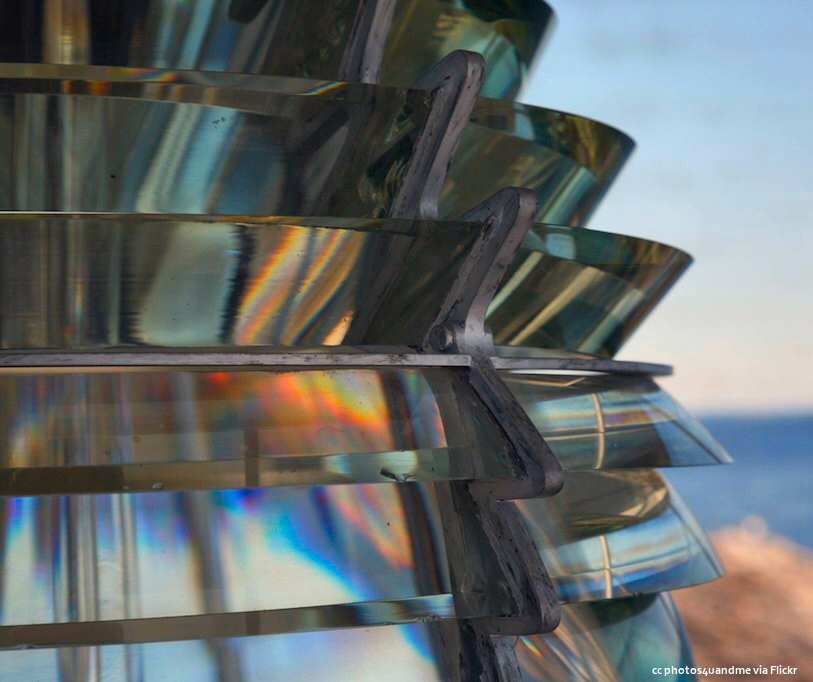 A closeup of the beautifully crafted glass of a Fresnel lens from a lighthouse
