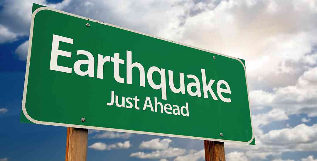 sign saying "Earthquake Just Ahead"