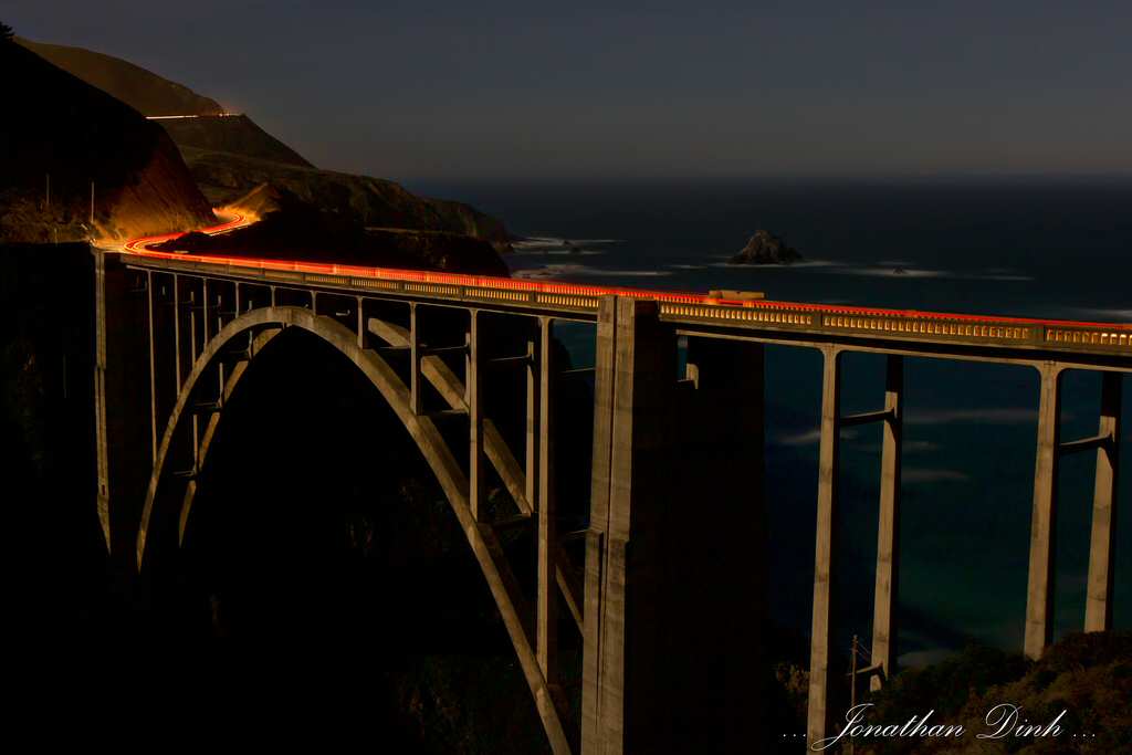 A timelapse of the Bixby Bridge with streaks of tailights